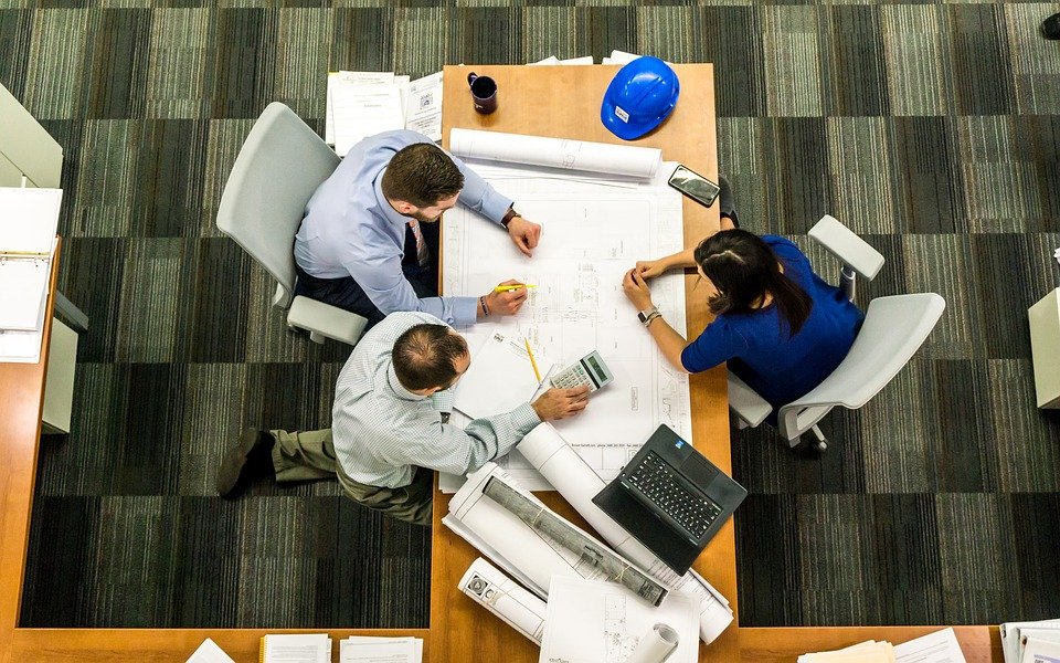 A top down shot of a meeting around a conference table