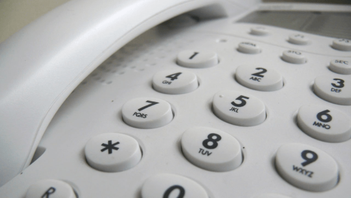 A close up shot of a landline phones numbers
